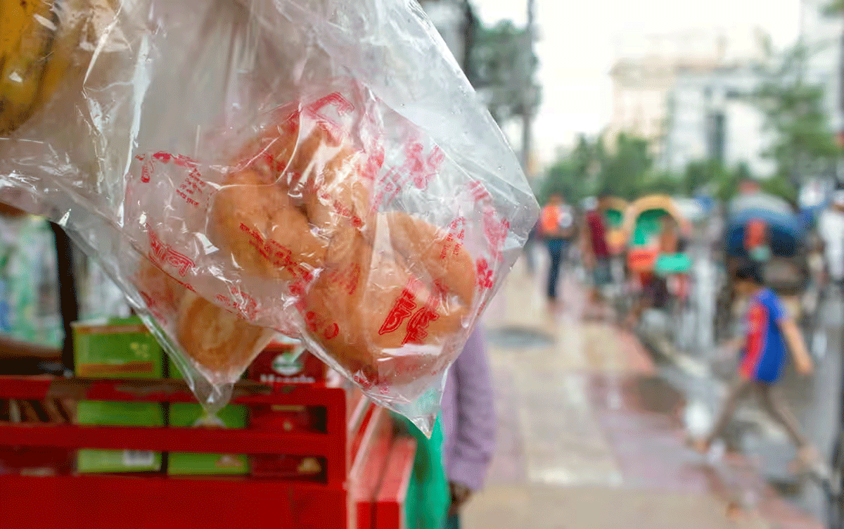 Buns-in-plastic-packaging-hang-from-a-snack-stall-by-the-side-of-a-road-in-Dhaka_Photograph_Farzana-Hossen_The-Guardian
