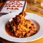 Interno della trattoria MagnaMagna a Viterbo, il locale che ha contribuito alla rinascita gastronomica di piazza della Morte nel centro medievale della città