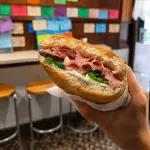 L'interno della paninoteca Dalla Zita a Padova con il caratteristico muro ricoperto di cartellini che raccontano oltre 200 panini diversi