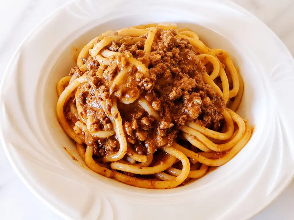 piatto di pici toscani con chianina